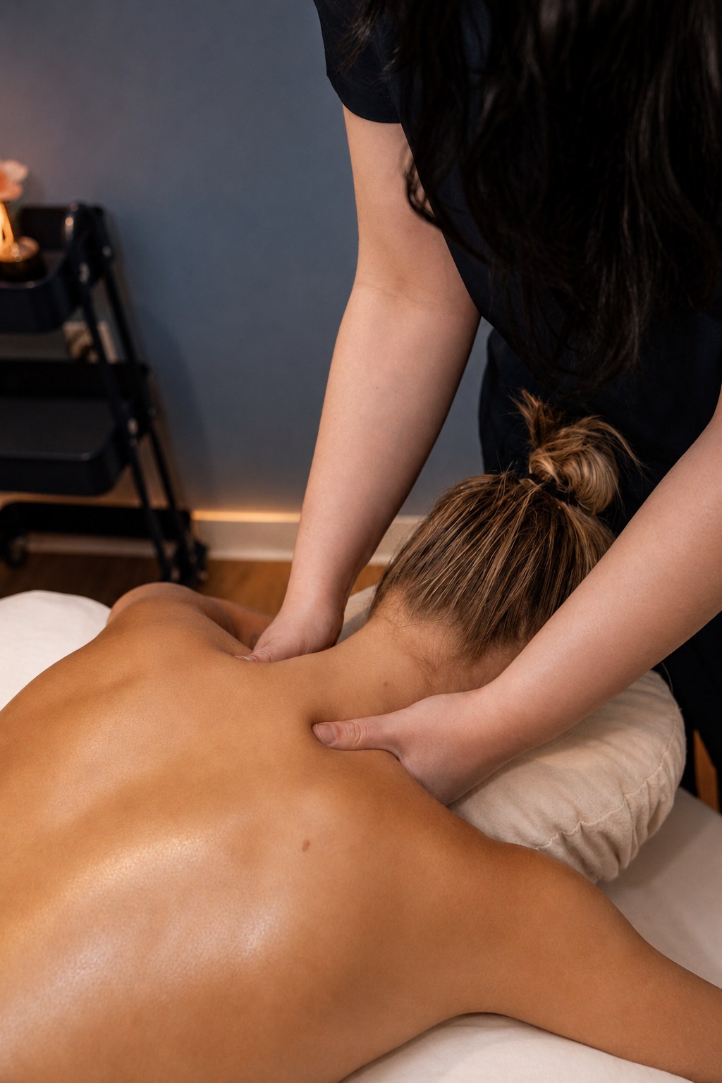Therapist working the neck and shoulders during body alignment massage in Portsmouth, NH