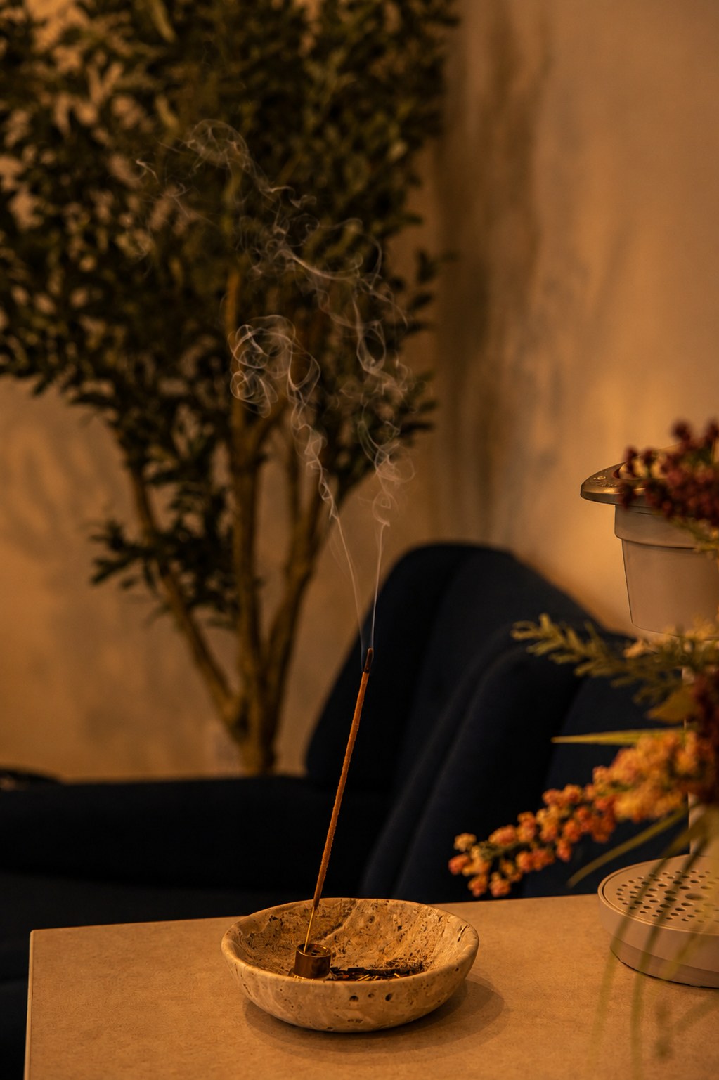 Incense resting in a stone dish in the lounge at the Portsmouth studio