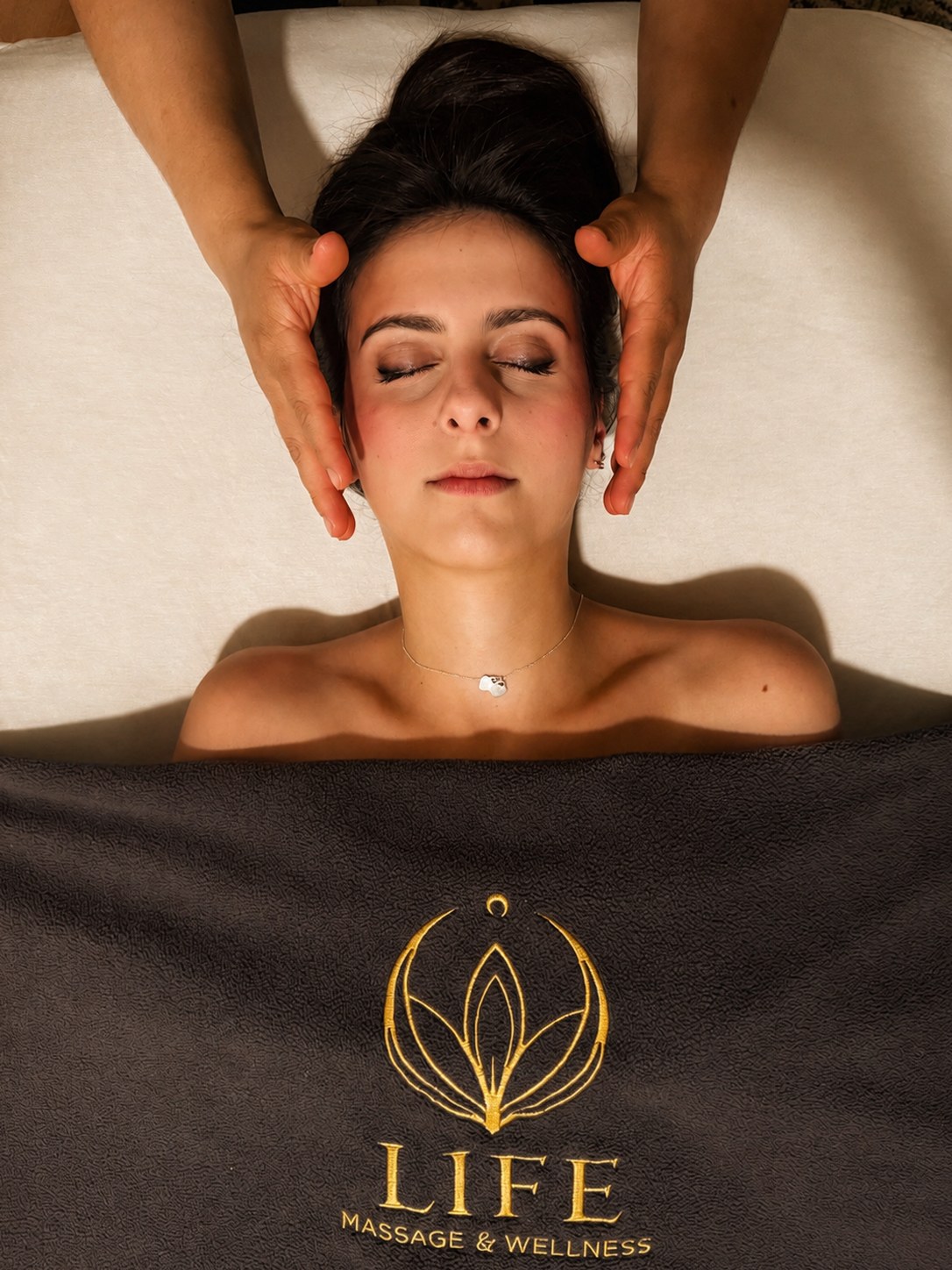 Gentle temple massage with a client wrapped in a warm blanket
