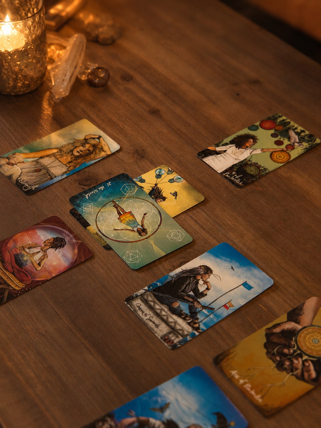 Cards drawn among candles during a guidance session